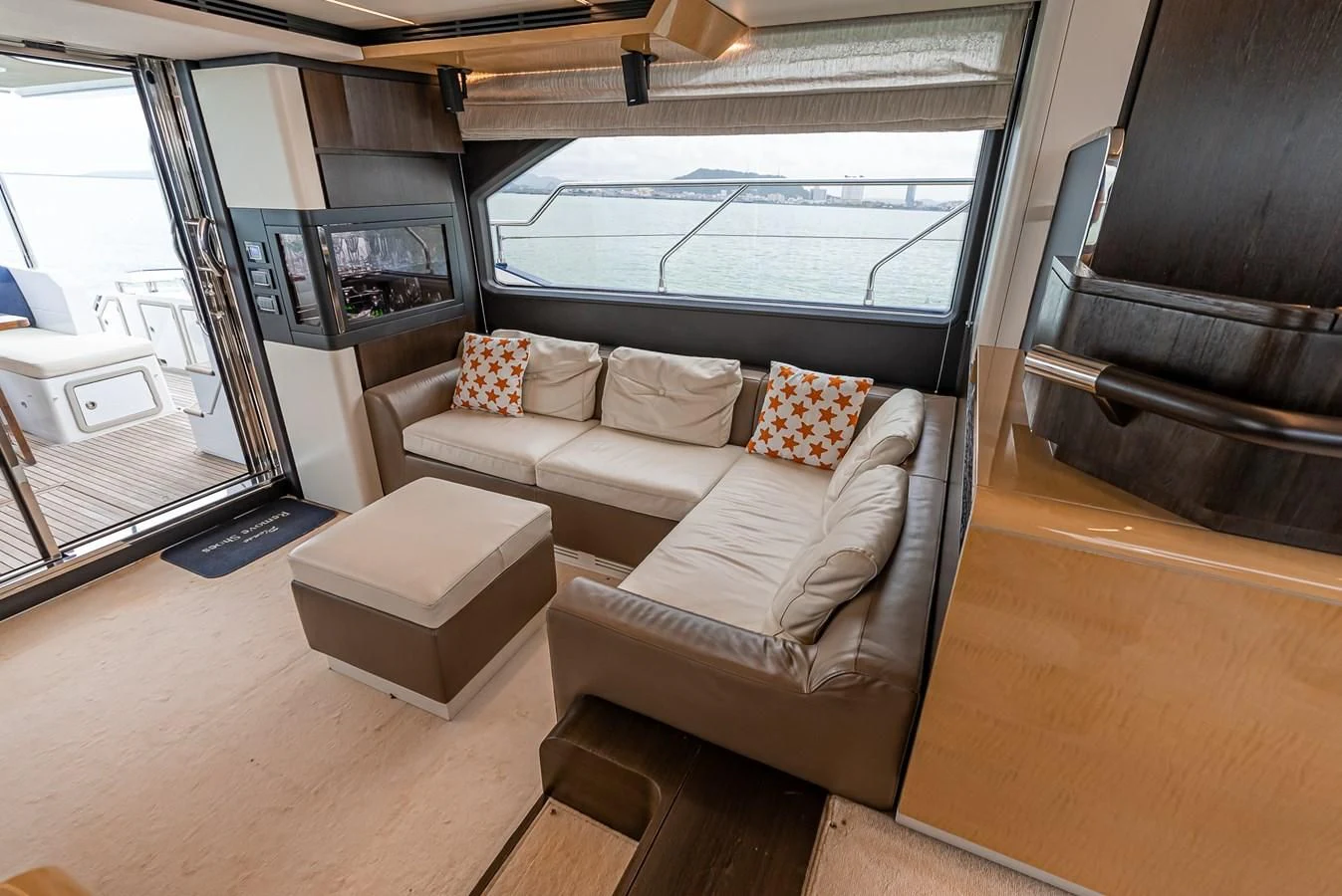 a living room with a couch and a table aboard PRIVE Yacht for Sale