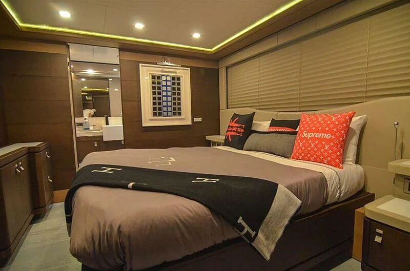 a bed in a hotel room aboard SE7EN Yacht for Sale