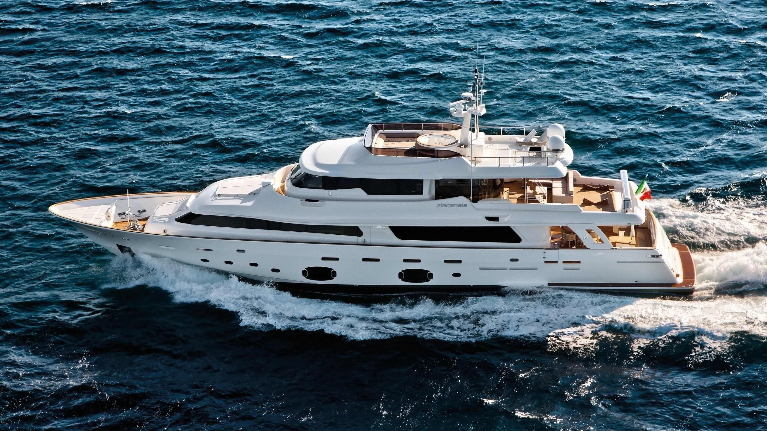 a white yacht in the water aboard SE7EN Yacht for Sale