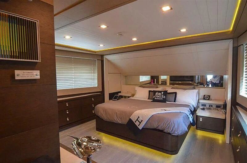 a bedroom with a bed aboard SE7EN Yacht for Sale