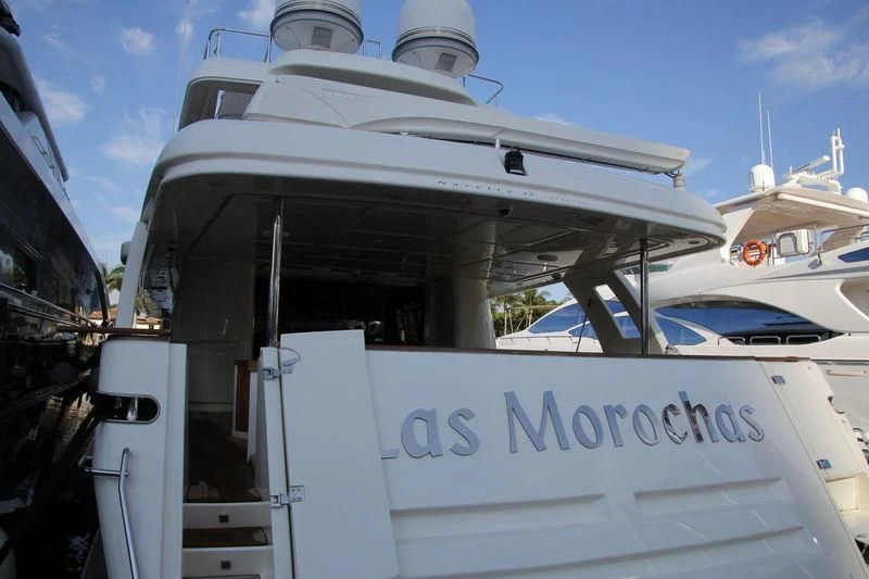 a boat with a sign on the front aboard SE7EN Yacht for Sale