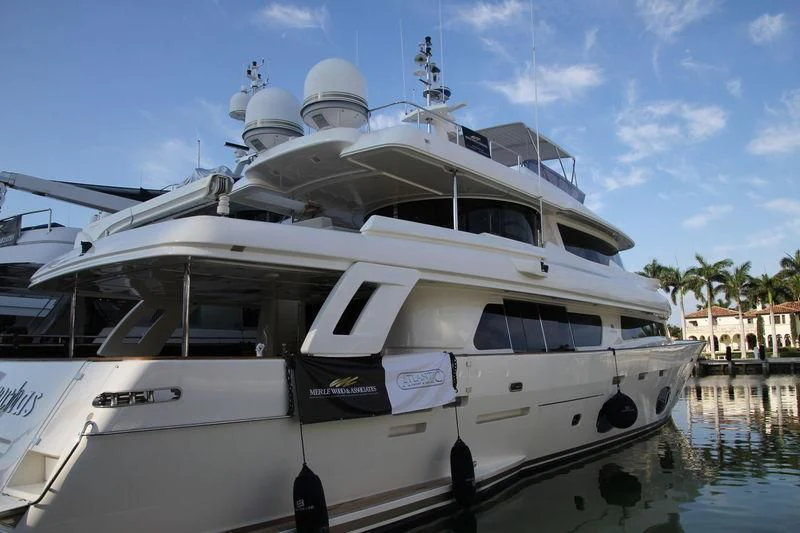 a white yacht docked aboard SE7EN Yacht for Sale