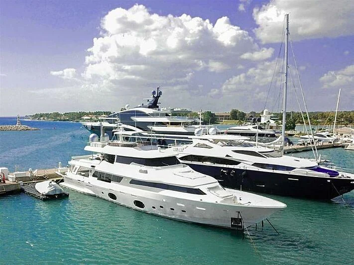 a group of boats in a harbor aboard SE7EN Yacht for Sale