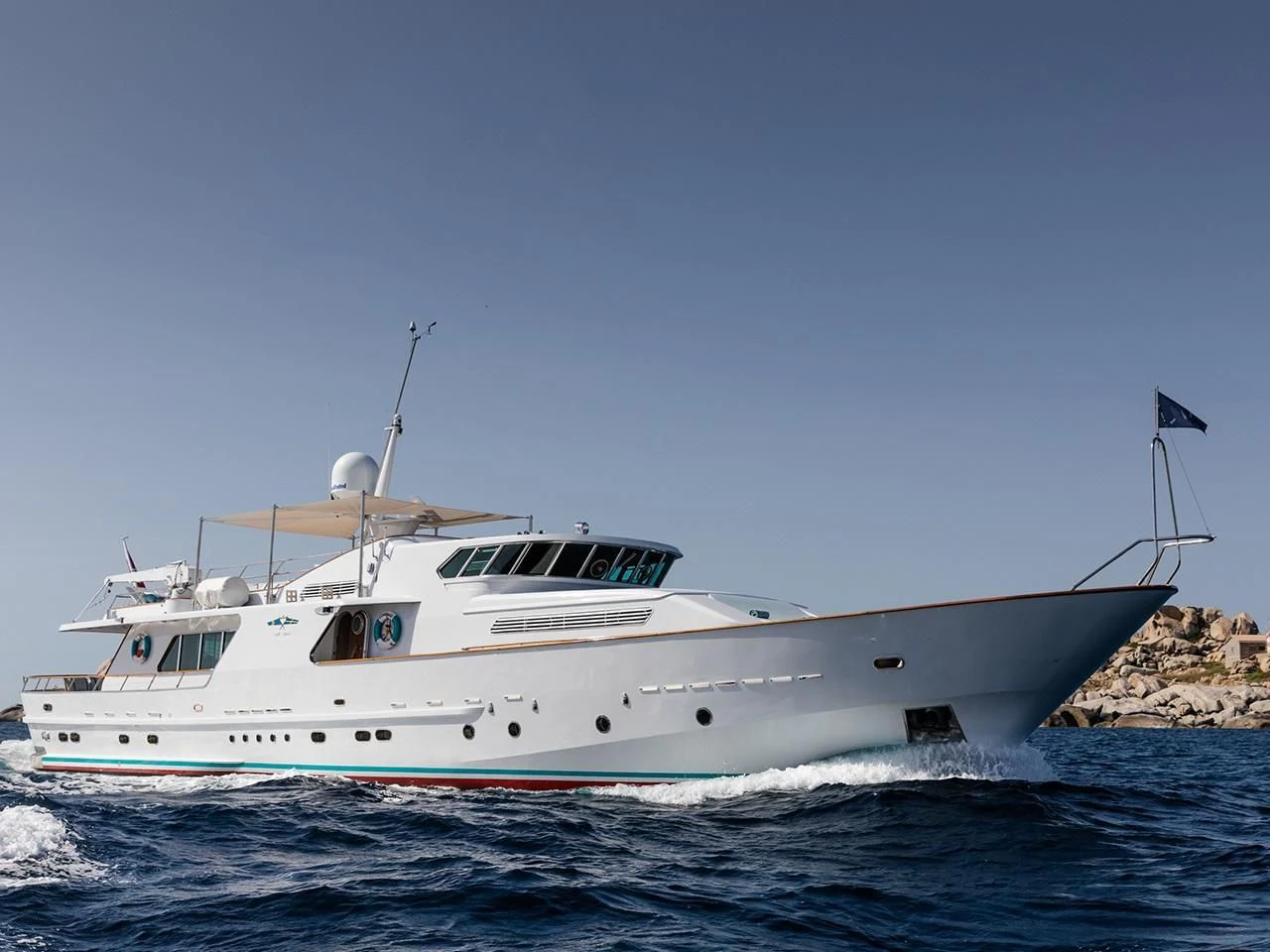 a white boat in the water aboard VESPUCCI Yacht for Sale