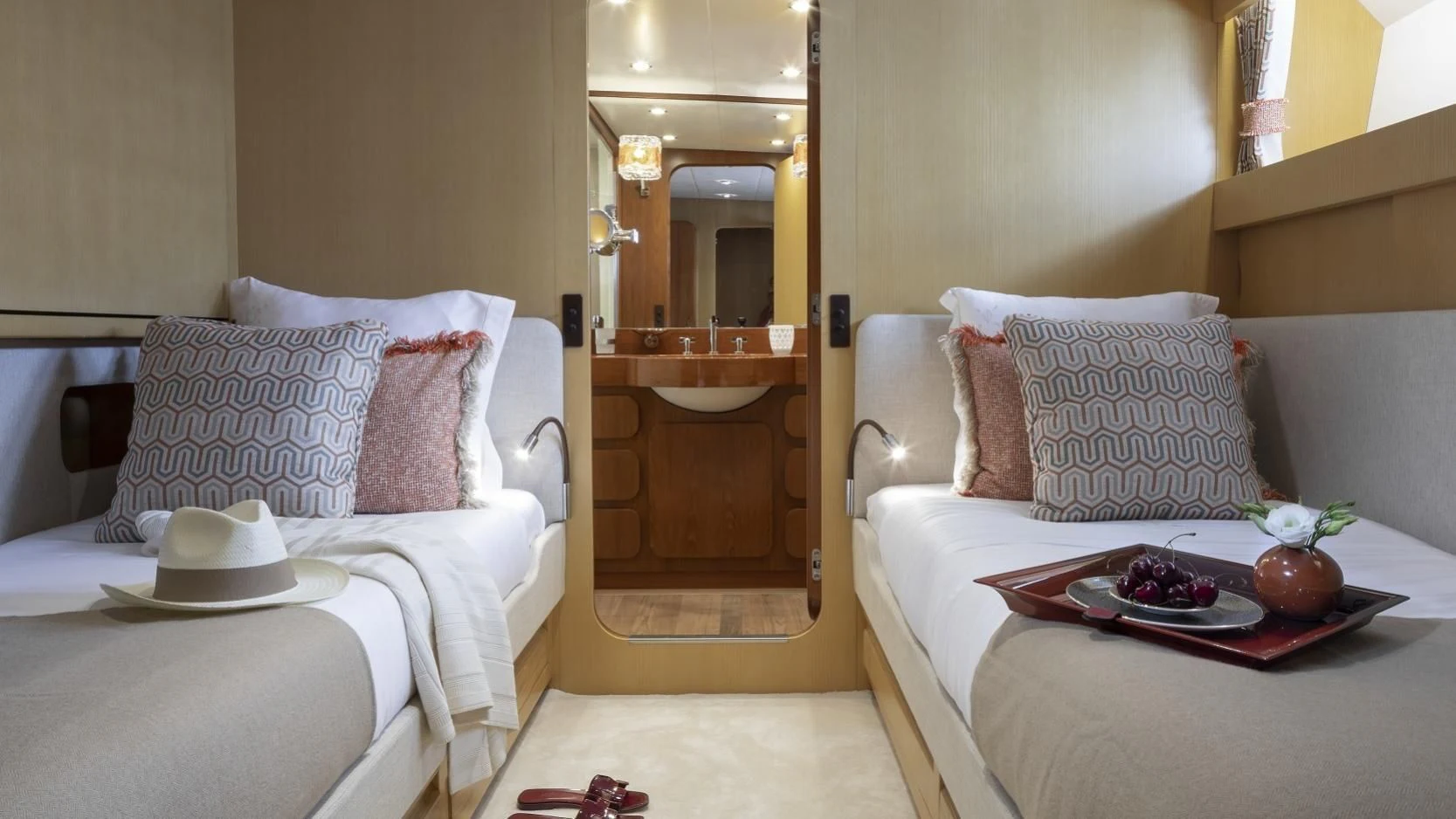a room with a bed and a table aboard VESPUCCI Yacht for Sale