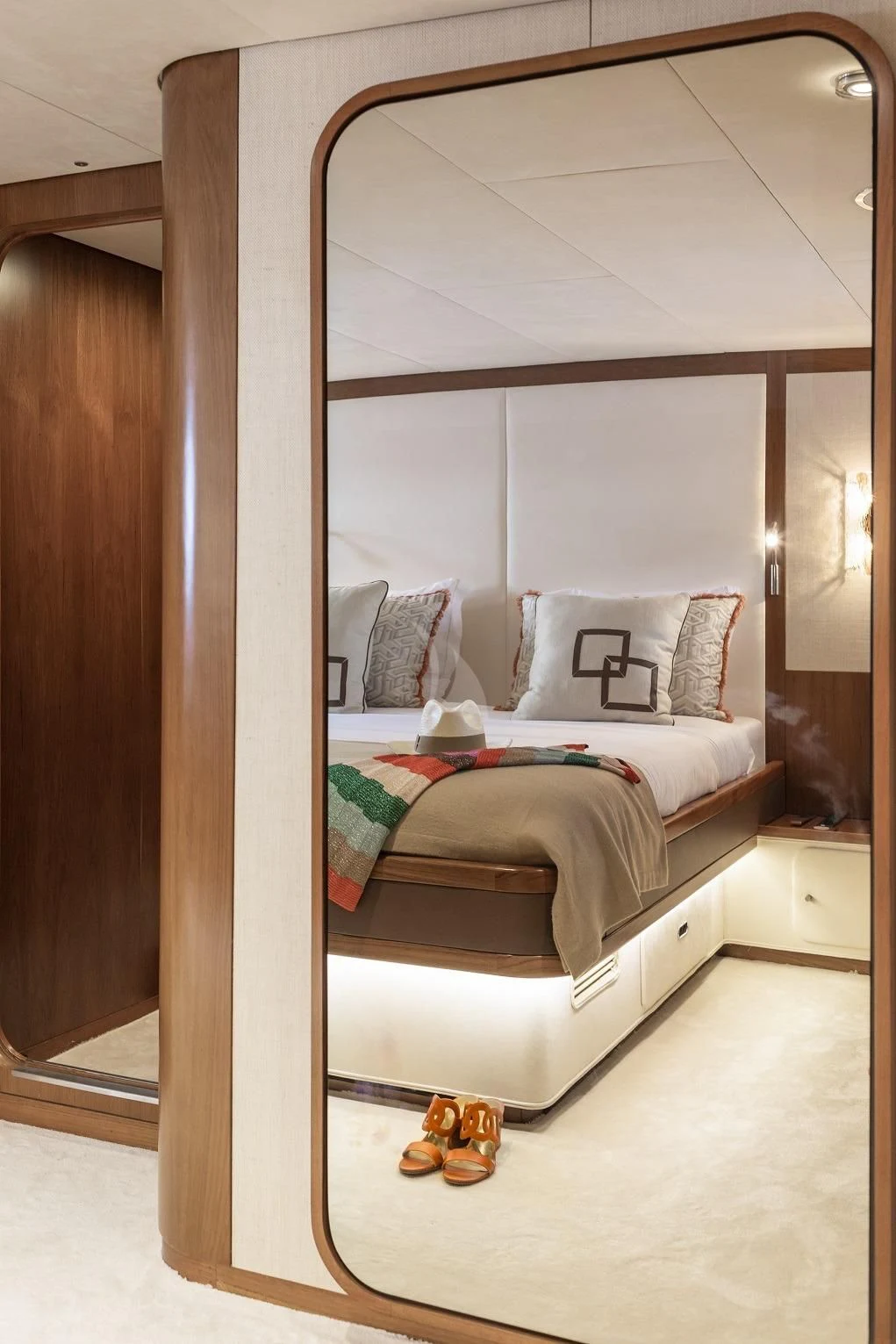 a bed with a wooden frame aboard VESPUCCI Yacht for Sale