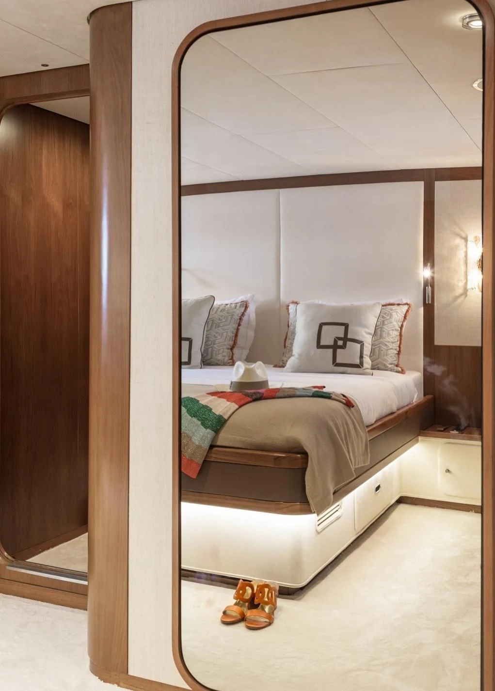 a bed with a white bed frame aboard VESPUCCI Yacht for Sale