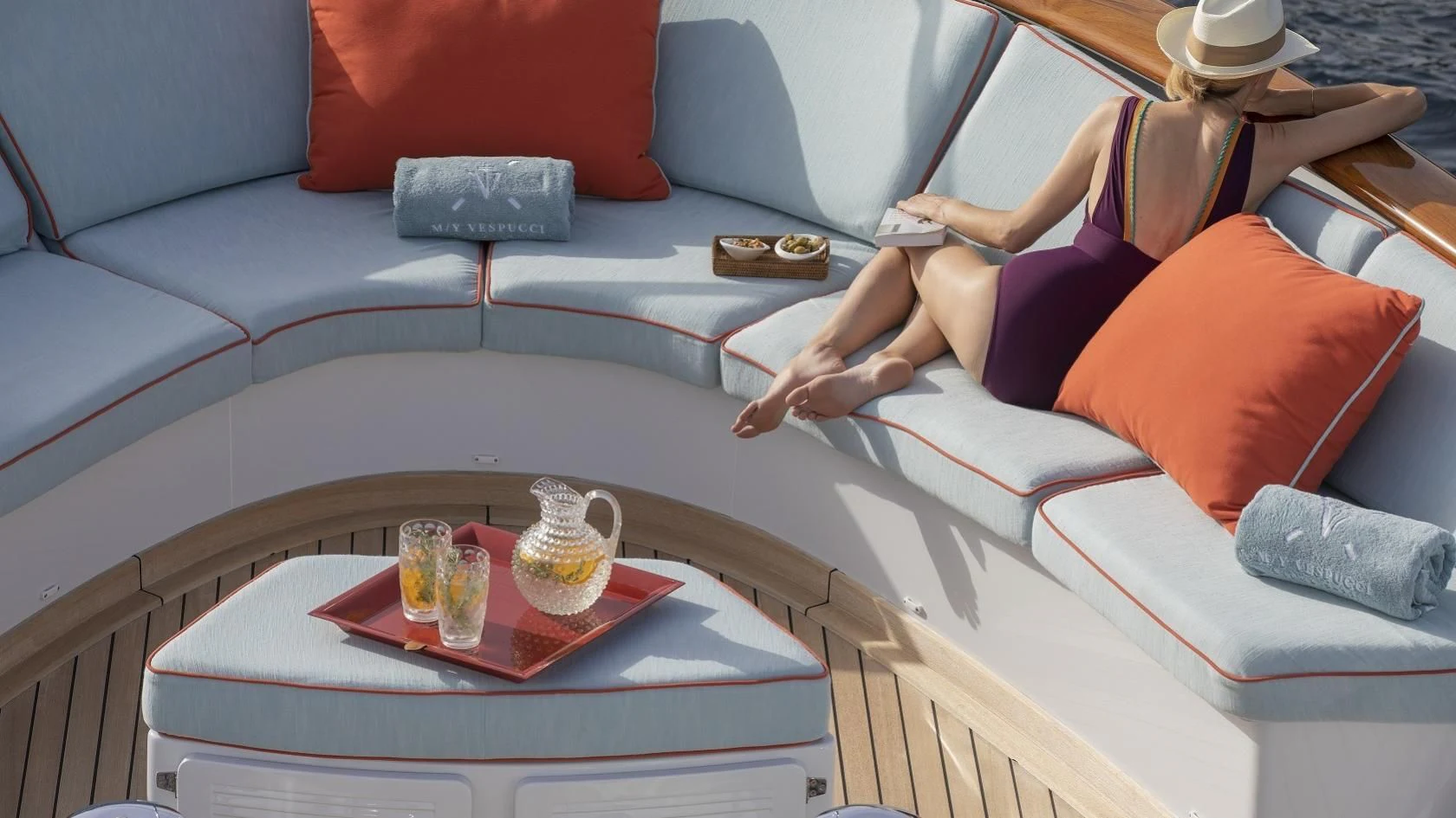 a person sitting on a couch aboard VESPUCCI Yacht for Sale