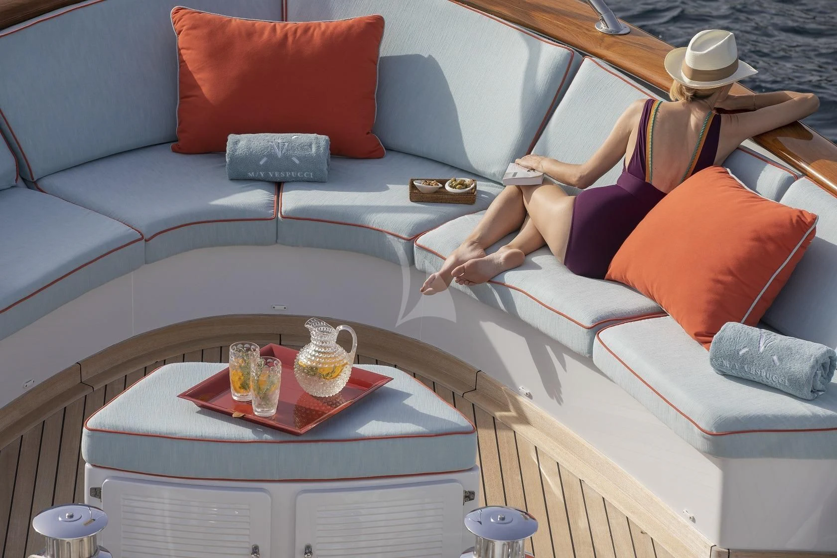 a person sitting on a couch aboard VESPUCCI Yacht for Sale