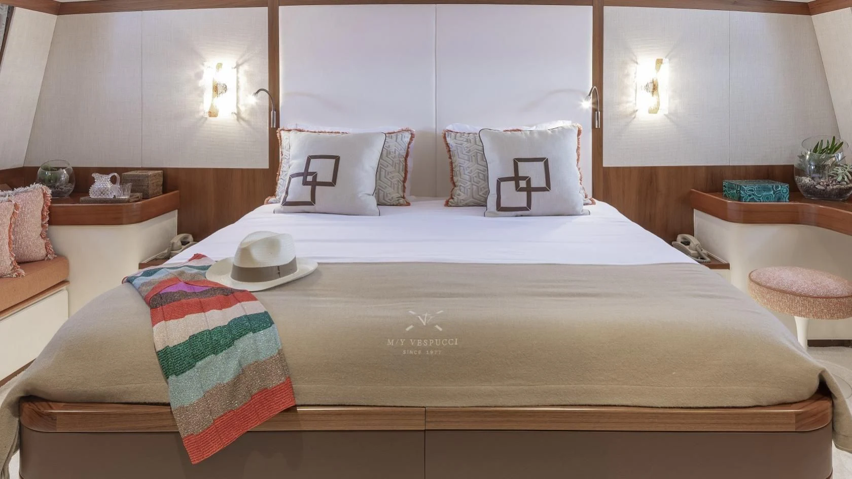 a bed with white sheets and pillows aboard VESPUCCI Yacht for Sale