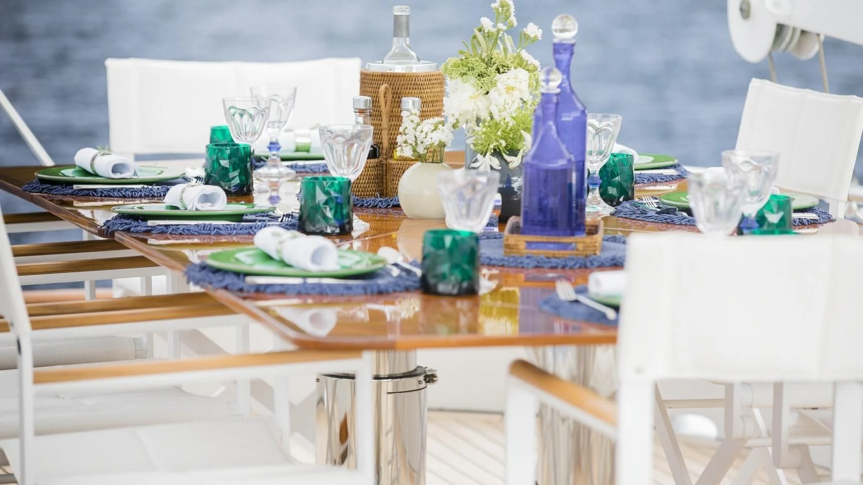 a table with plates and glasses on it aboard VESPUCCI Yacht for Sale