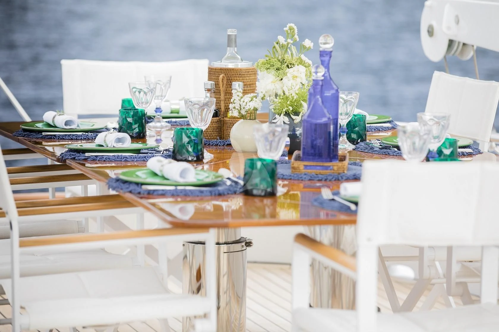 a table with plates and glasses aboard VESPUCCI Yacht for Sale