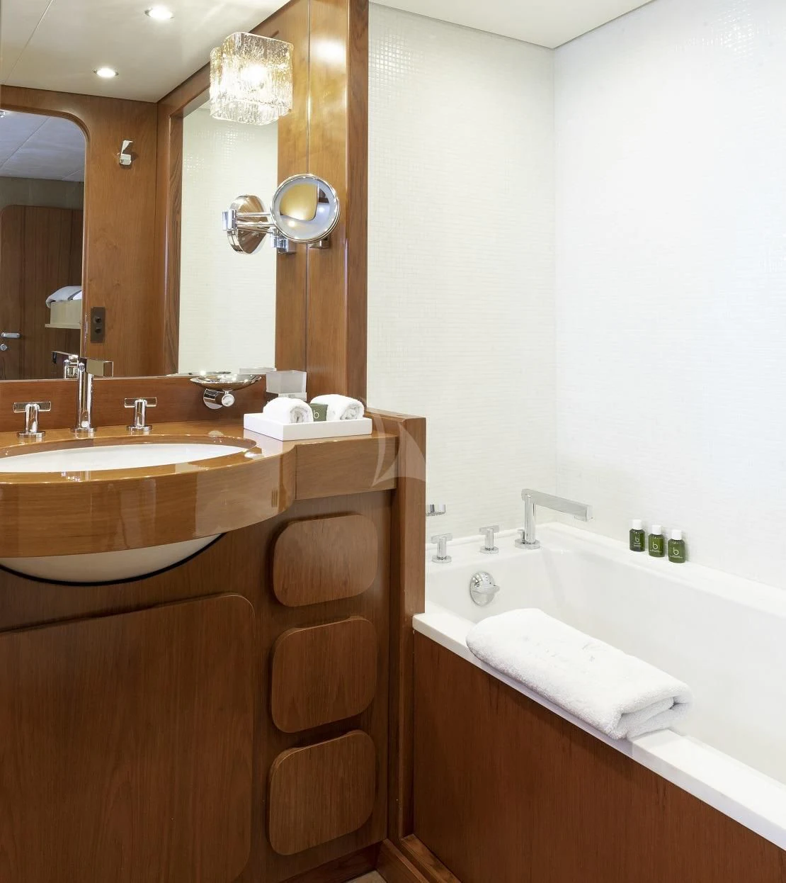 a bathroom with a sink and a mirror aboard VESPUCCI Yacht for Sale