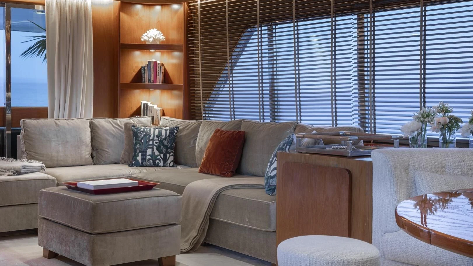 a living room with a couch and a table aboard VESPUCCI Yacht for Sale