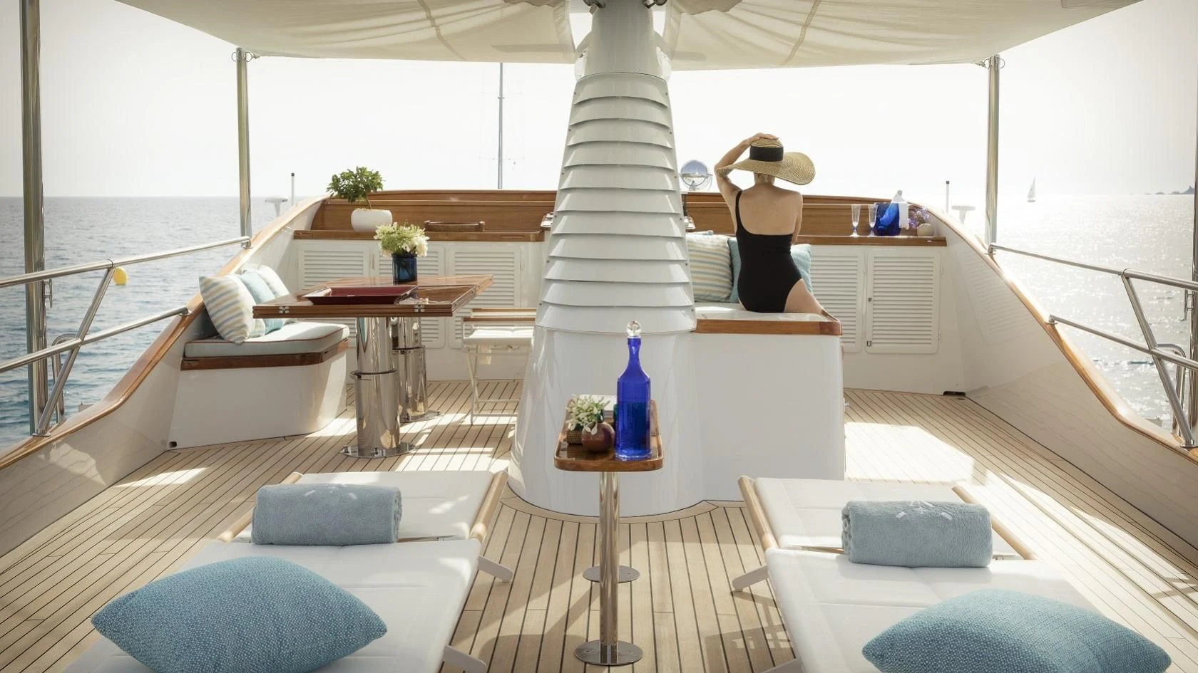 a person standing on a deck aboard VESPUCCI Yacht for Sale