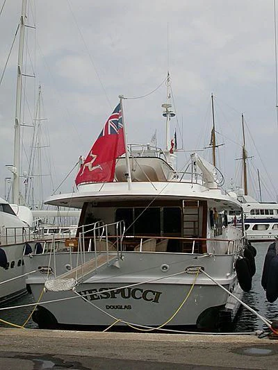 a boat with a flag on it aboard VESPUCCI Yacht for Sale
