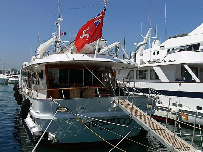 a boat with a flag on the front aboard VESPUCCI Yacht for Sale