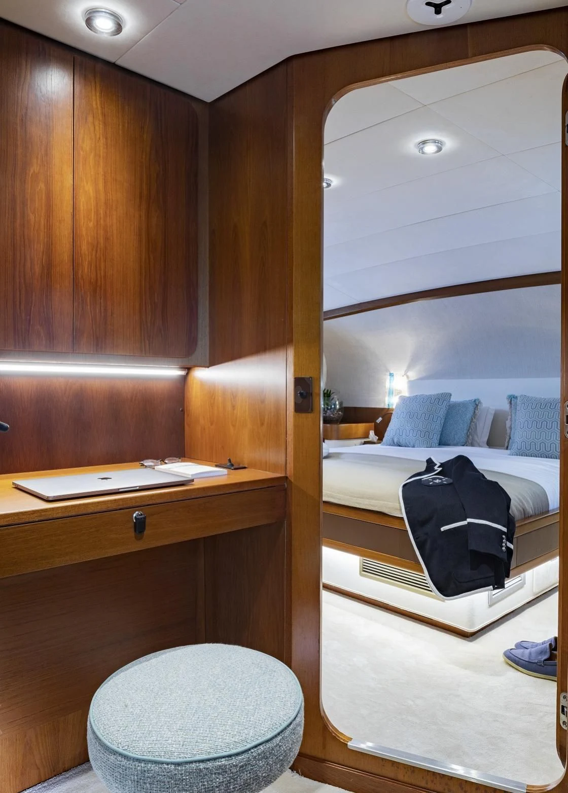 a room with a bed and a mirror aboard VESPUCCI Yacht for Sale