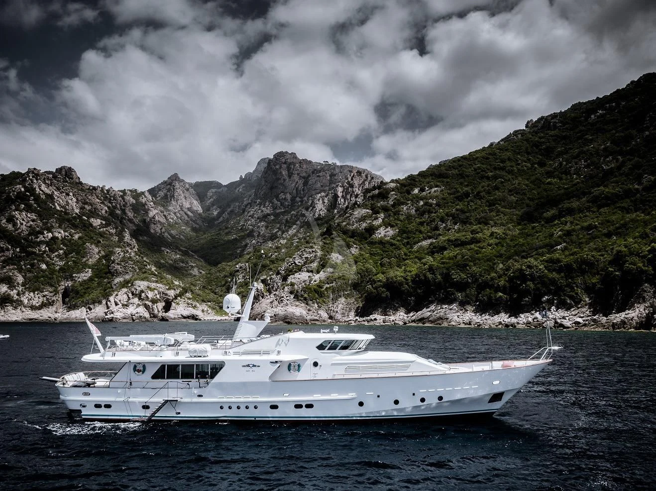 a white yacht on the water aboard VESPUCCI Yacht for Sale