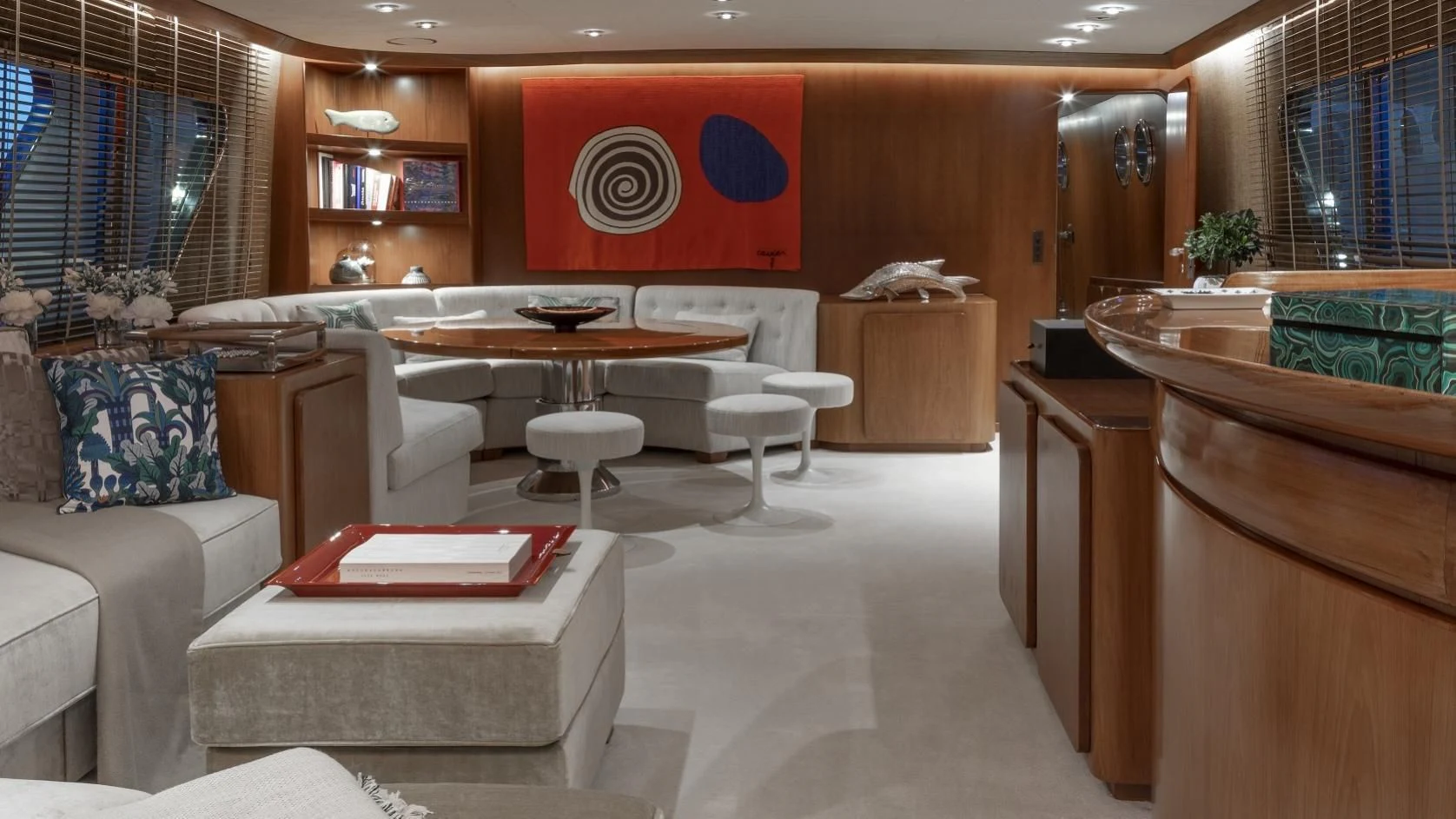 a room with a table chairs and a couch aboard VESPUCCI Yacht for Sale