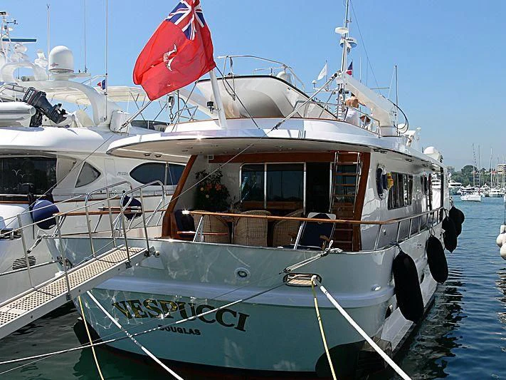 a boat with flags on it aboard VESPUCCI Yacht for Sale