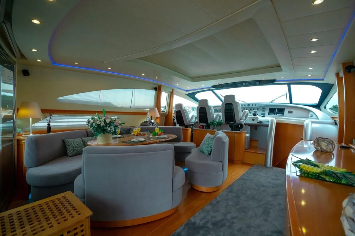 a room with a table and chairs aboard PERSHING 90 Yacht for Sale