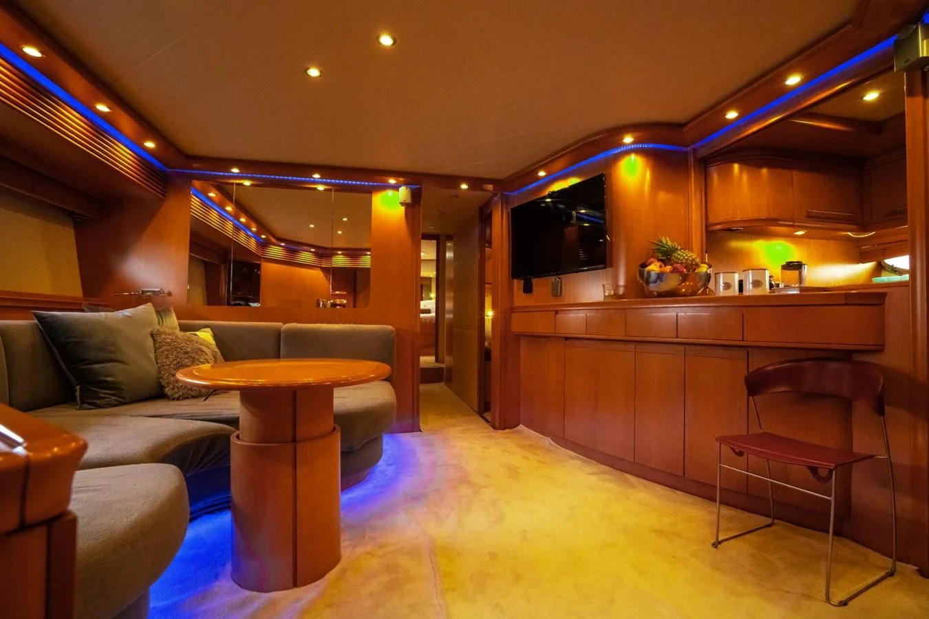 a living room with a couch and a table aboard PERSHING 90 Yacht for Sale
