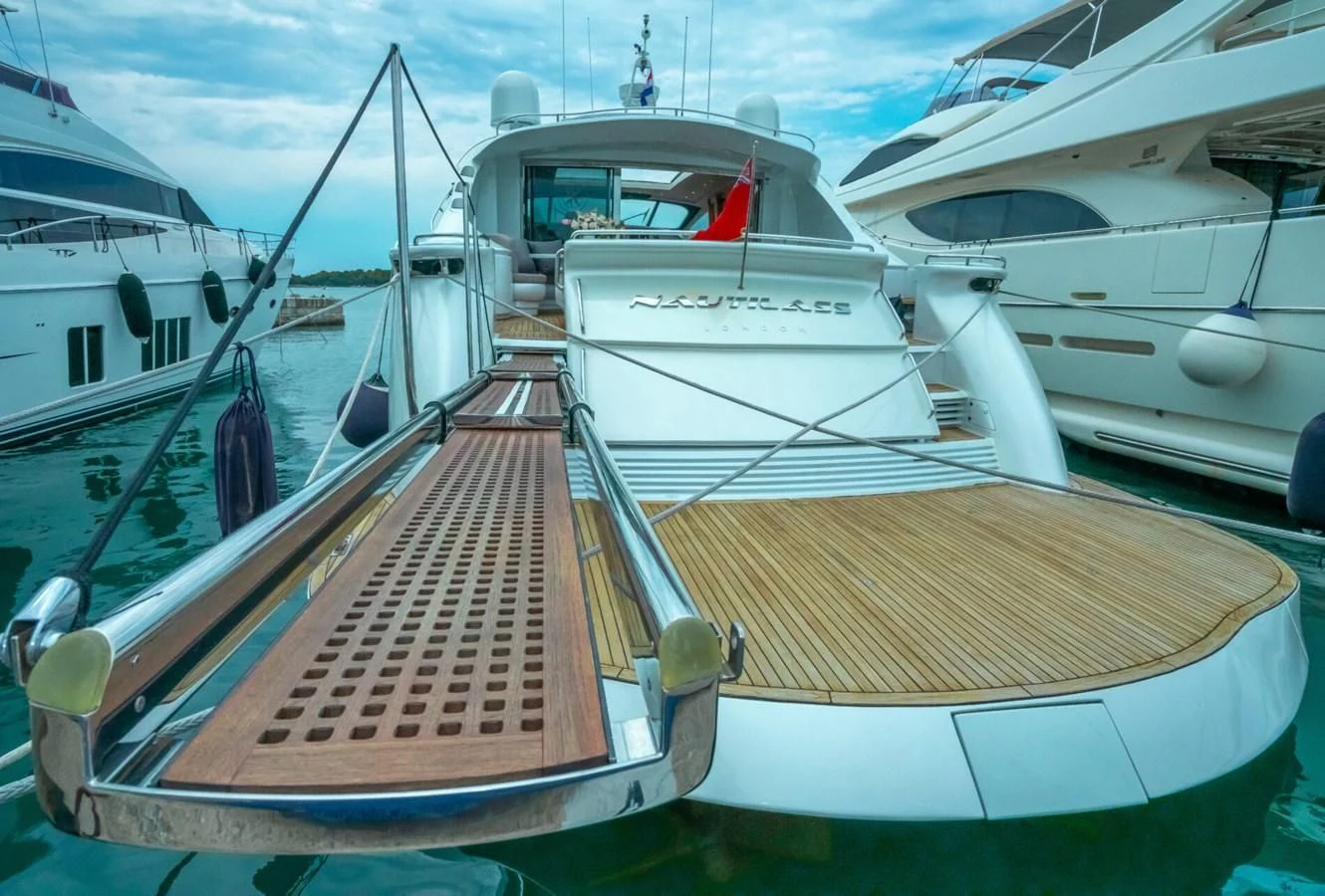 a group of boats are parked in a harbor aboard PERSHING 90 Yacht for Sale