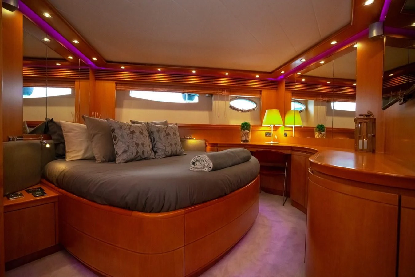 a living room with a couch and a table aboard PERSHING 90 Yacht for Sale
