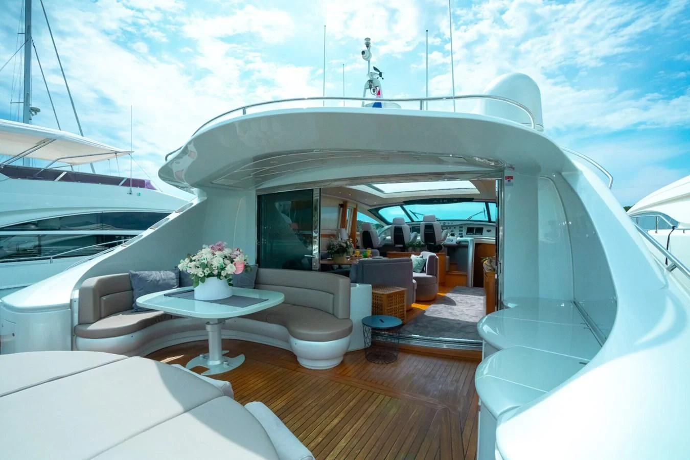a room with a table and chairs aboard PERSHING 90 Yacht for Sale