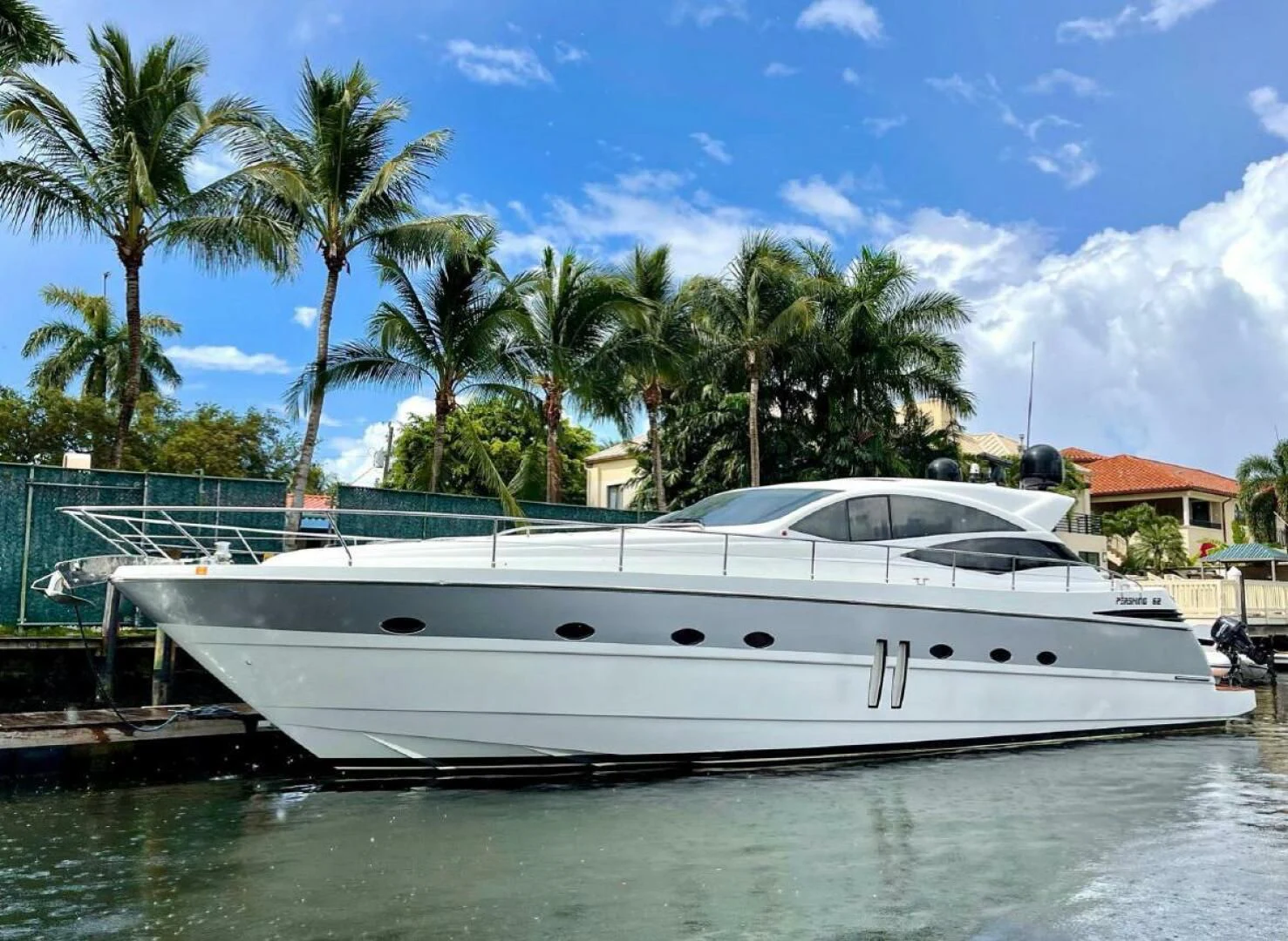 a white yacht docked at a pier aboard PERSHING 90 Yacht for Sale
