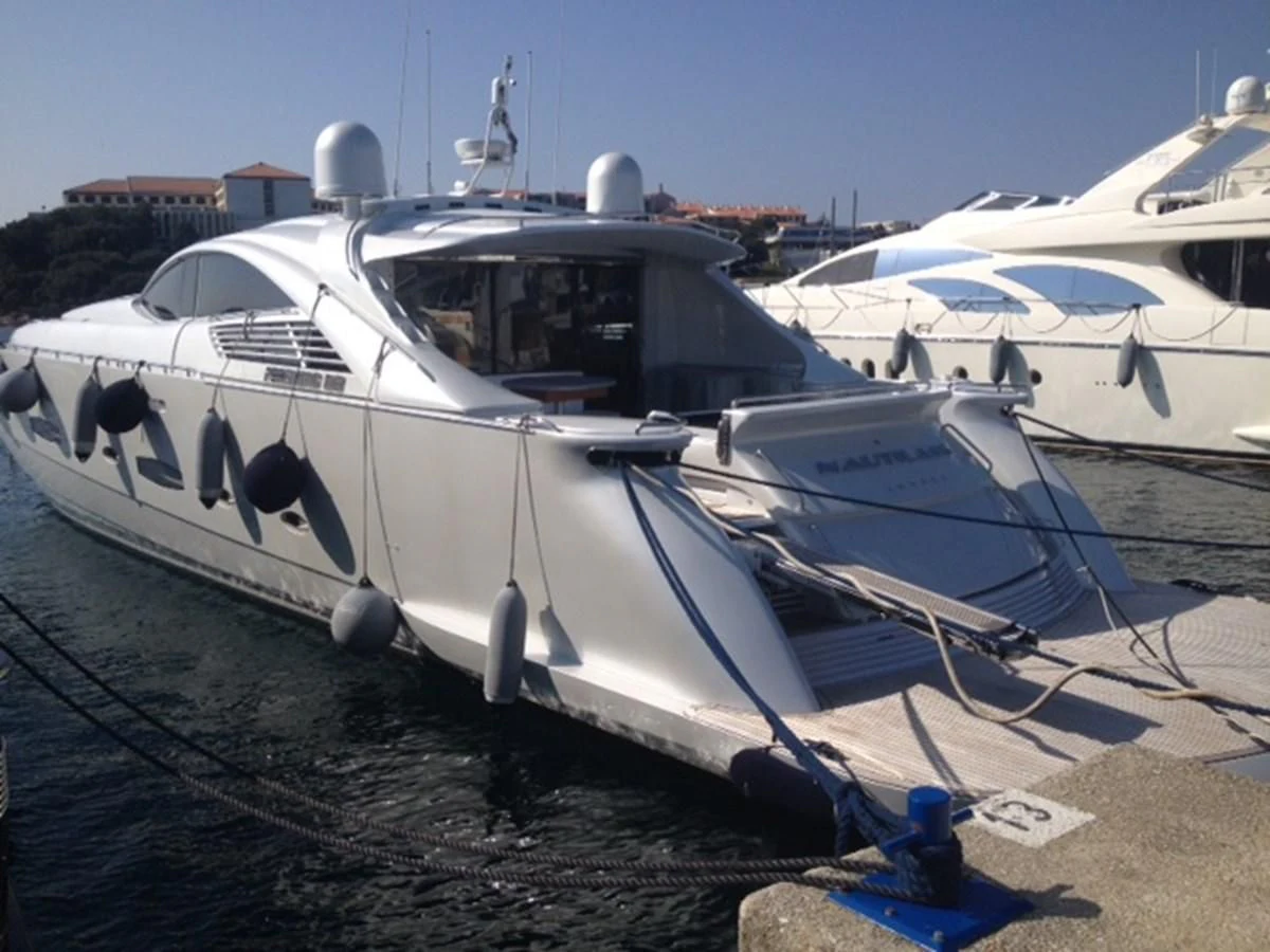 a couple of boats are parked aboard PERSHING 90 Yacht for Sale