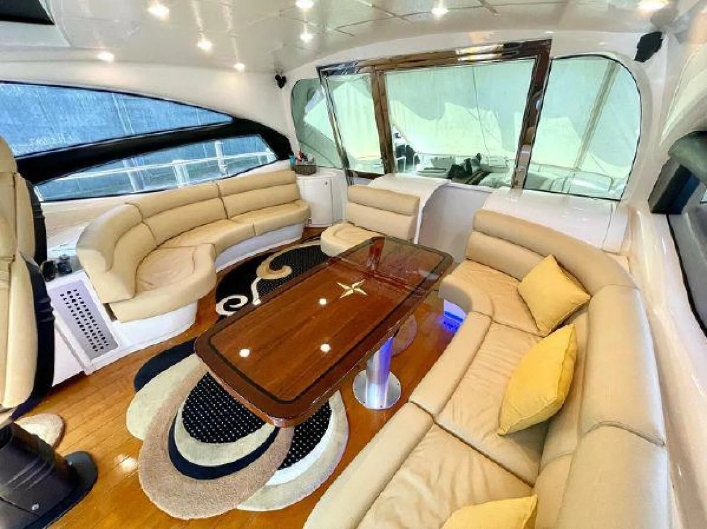 a car with a laptop on the table aboard PERSHING 90 Yacht for Sale