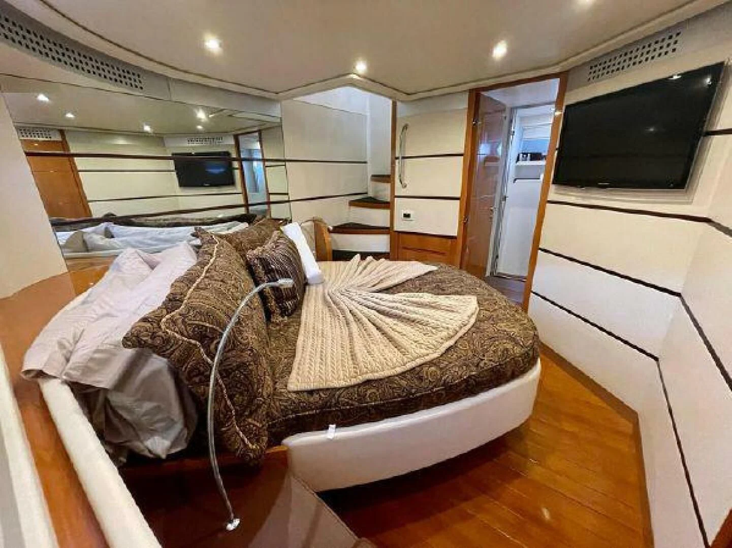 a bed in a room aboard PERSHING 90 Yacht for Sale