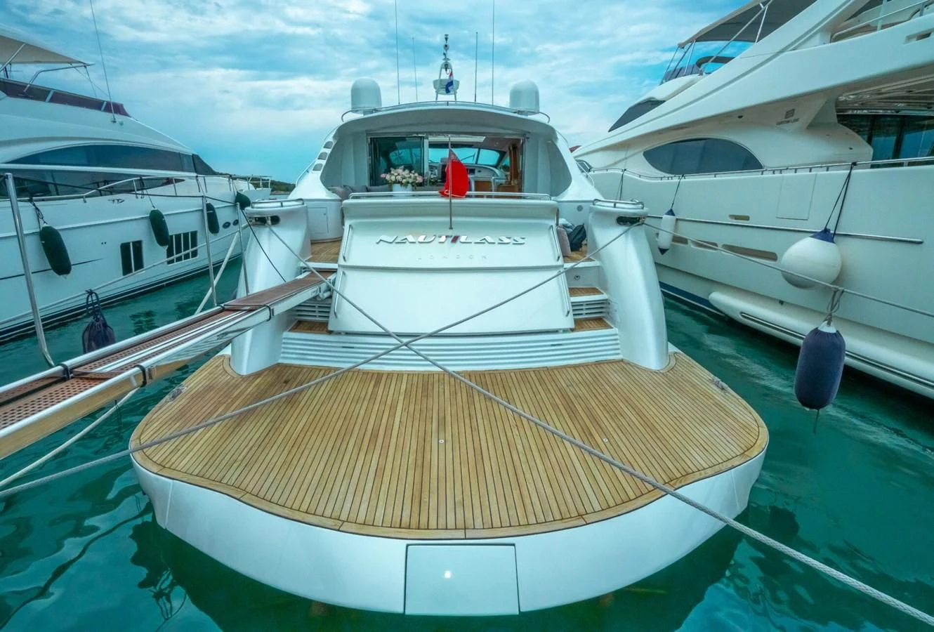 several boats are parked in a harbor aboard PERSHING 90 Yacht for Sale