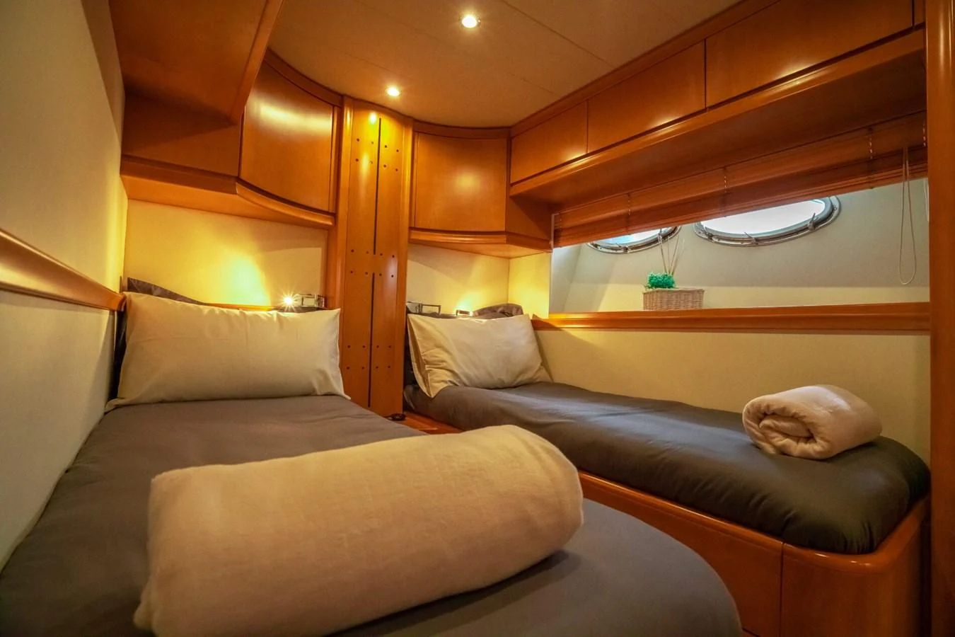 a room with couches and a window aboard PERSHING 90 Yacht for Sale