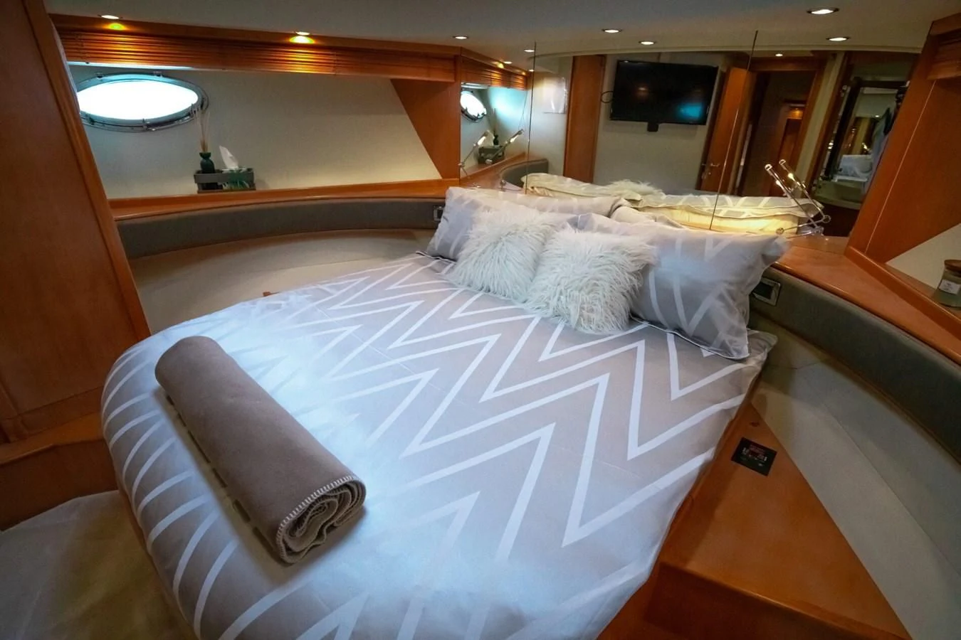 a bed with white sheets aboard PERSHING 90 Yacht for Sale