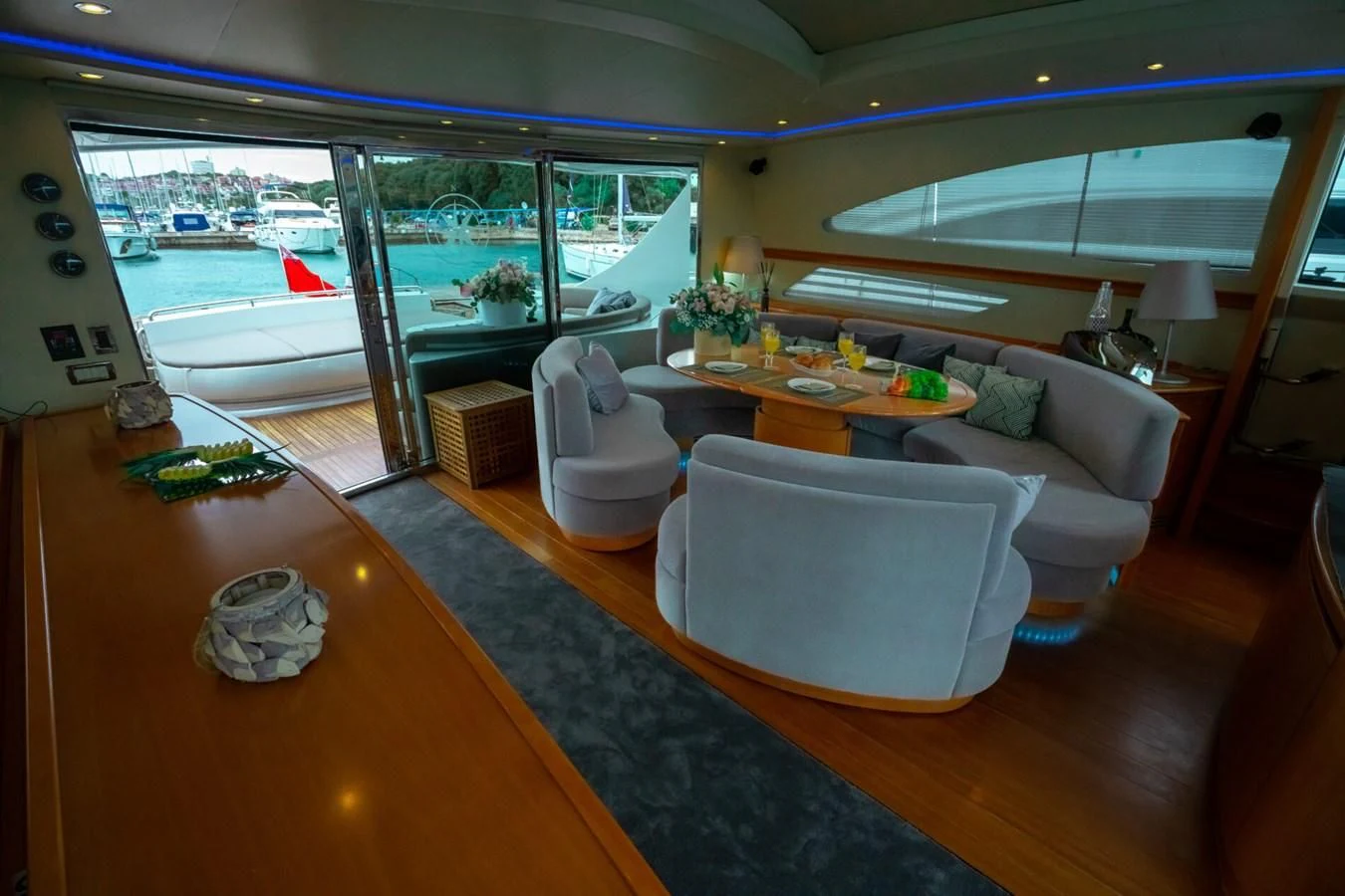 a living room with a large window aboard PERSHING 90 Yacht for Sale
