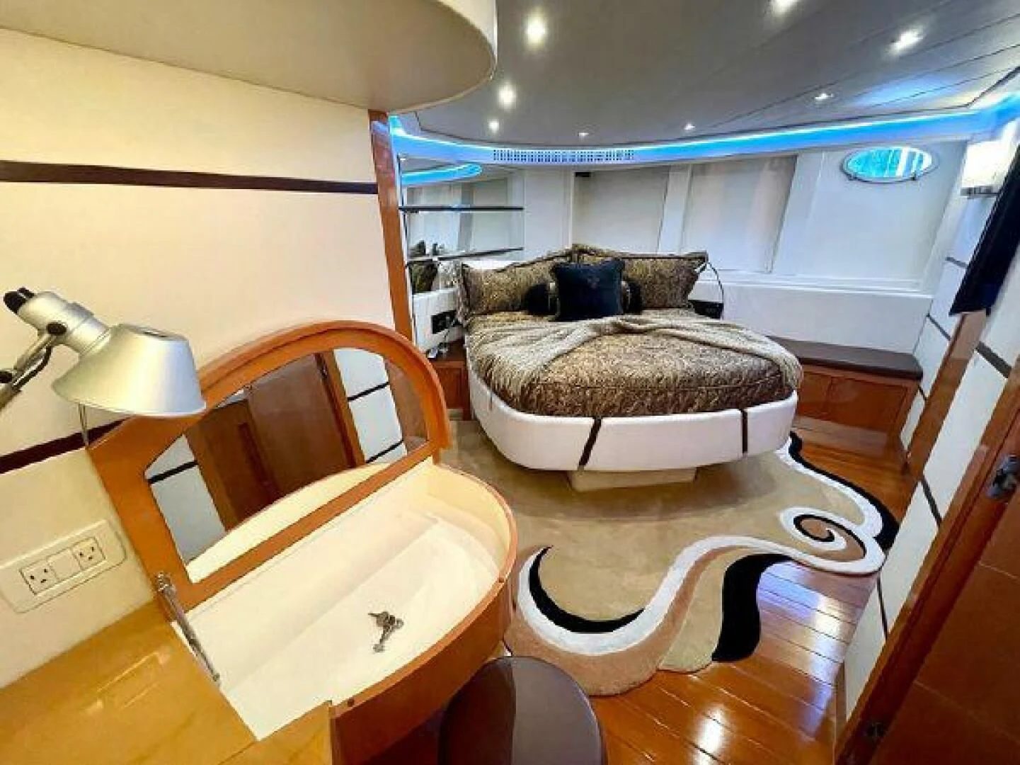 a room with a chair and a table aboard PERSHING 90 Yacht for Sale