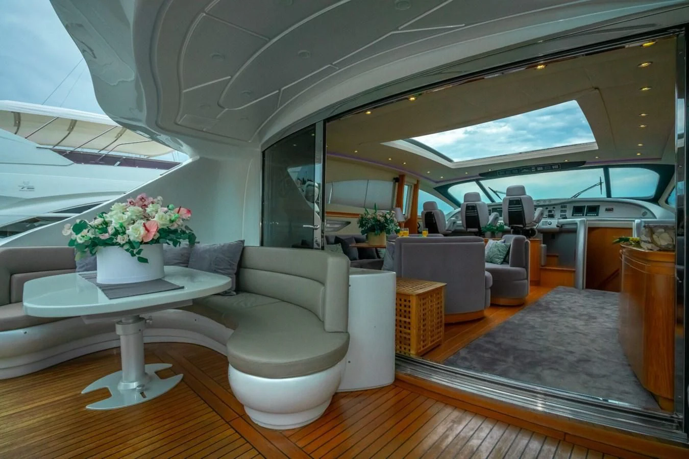 a room with a table and chairs aboard PERSHING 90 Yacht for Sale