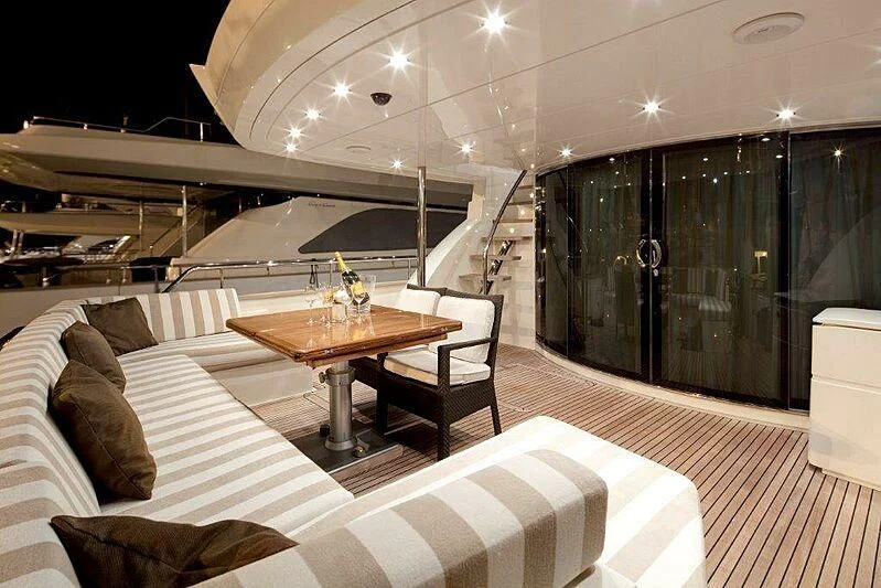a room with a table and chairs aboard SUN SHINE 1 Yacht for Sale