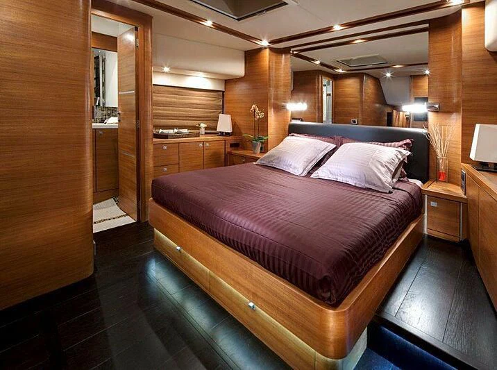 a bed in a room aboard SUN SHINE 1 Yacht for Sale