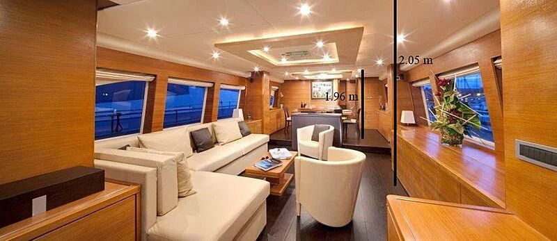 a living room with a large window aboard SUN SHINE 1 Yacht for Sale