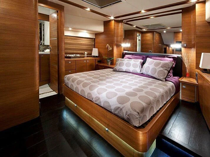 a bed in a room aboard SUN SHINE 1 Yacht for Sale