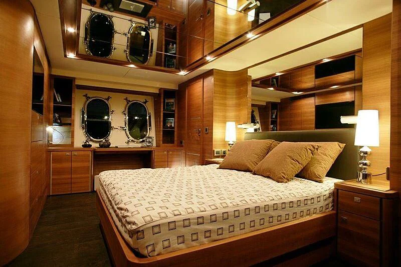 a bed in a room aboard SUN SHINE 1 Yacht for Sale