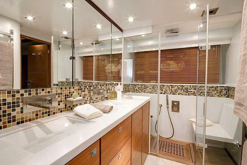 a bathroom with a bathtub and sink aboard SUN SHINE 1 Yacht for Sale