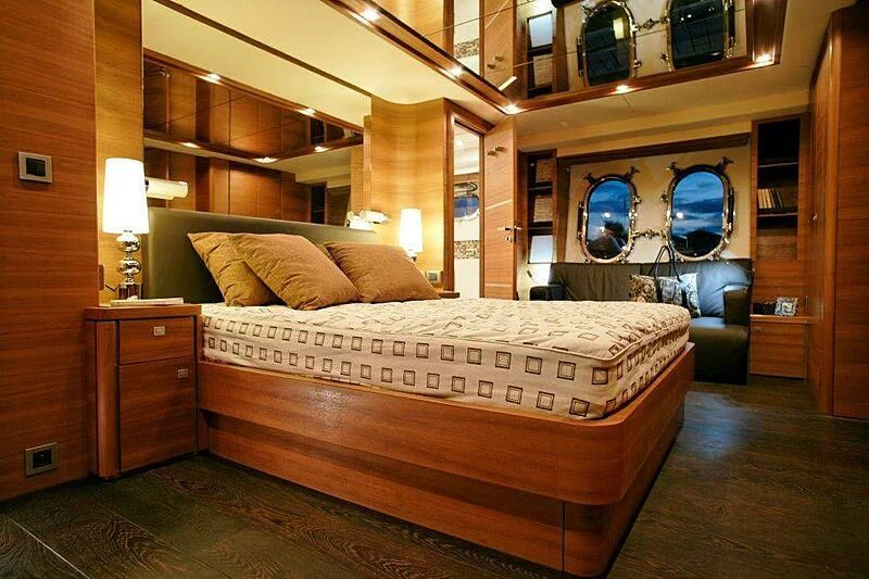 a bed in a room aboard SUN SHINE 1 Yacht for Sale