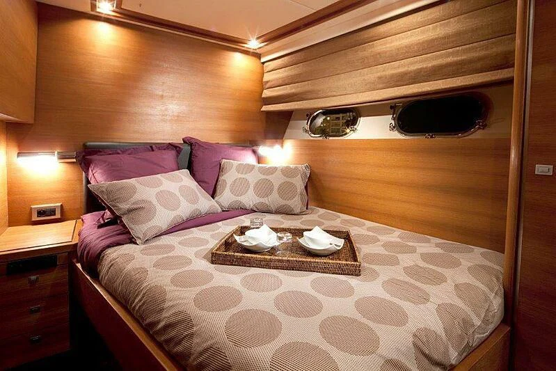 a bed with a tray on it aboard SUN SHINE 1 Yacht for Sale