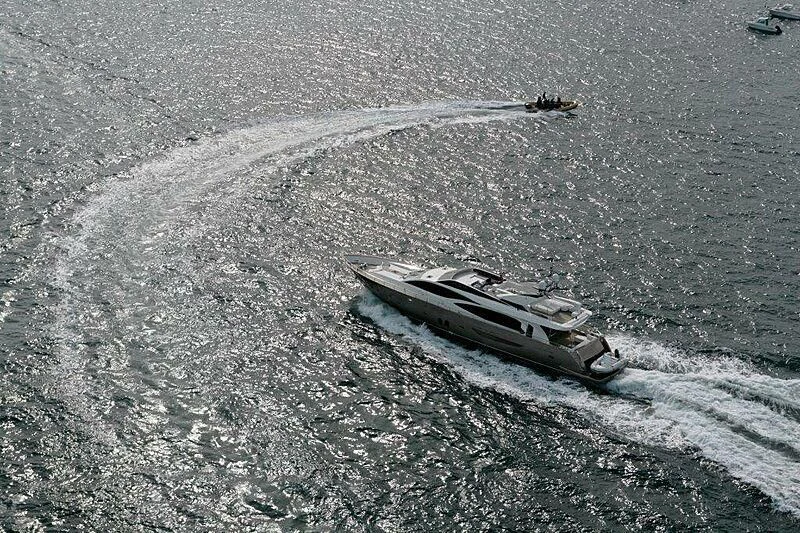 a military tank driving on a road aboard SUN SHINE 1 Yacht for Sale