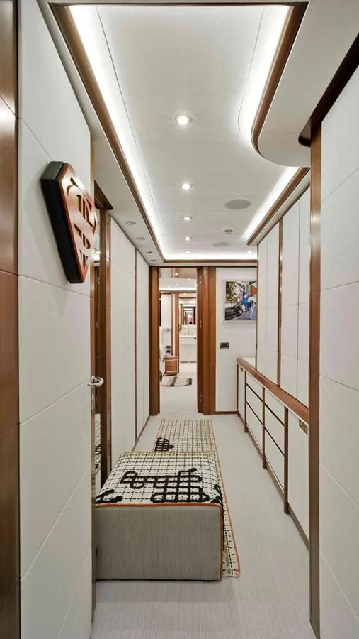 a hallway with a rug aboard BUNKER Yacht for Sale